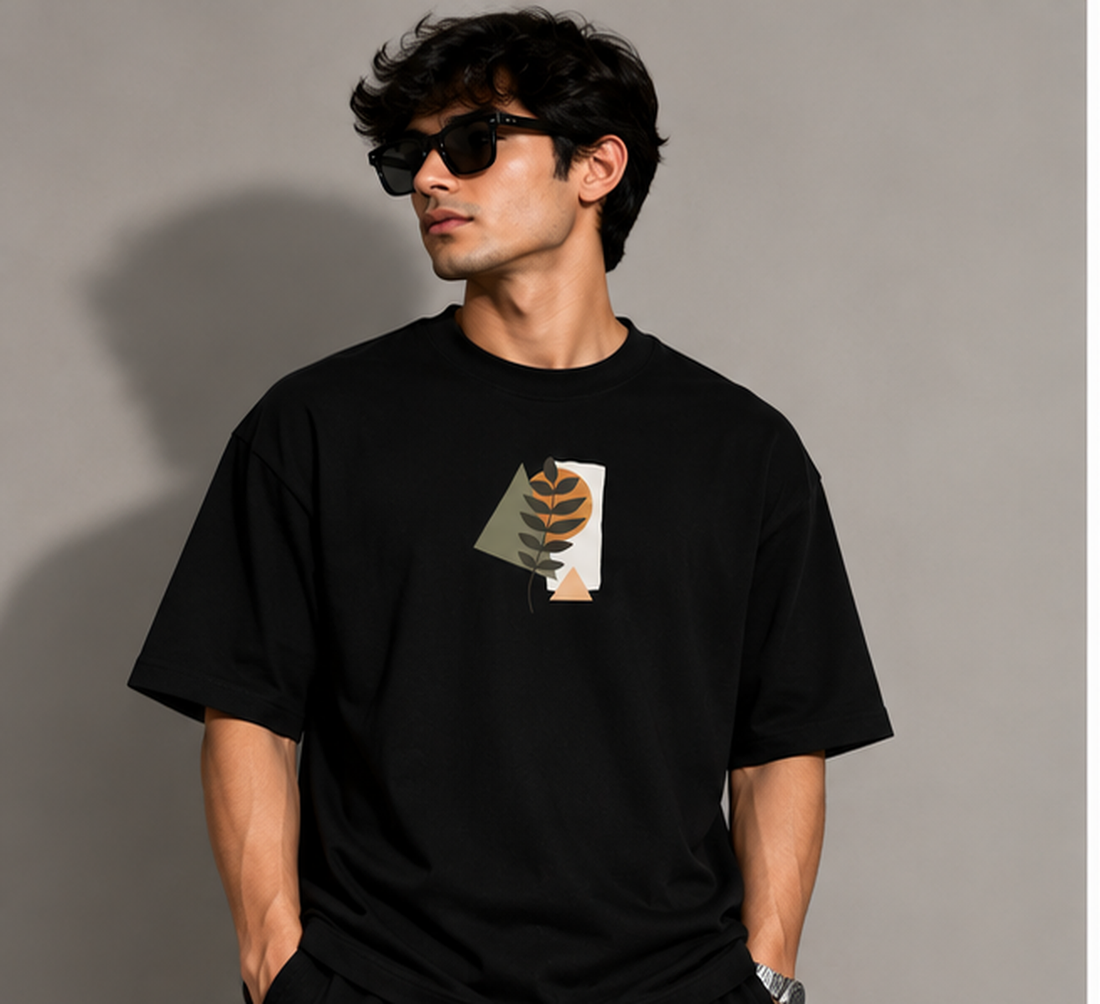 Model wearing the Selinx CLOTHE YOURSELF black oversized tee, front view with minimal leaf graphic