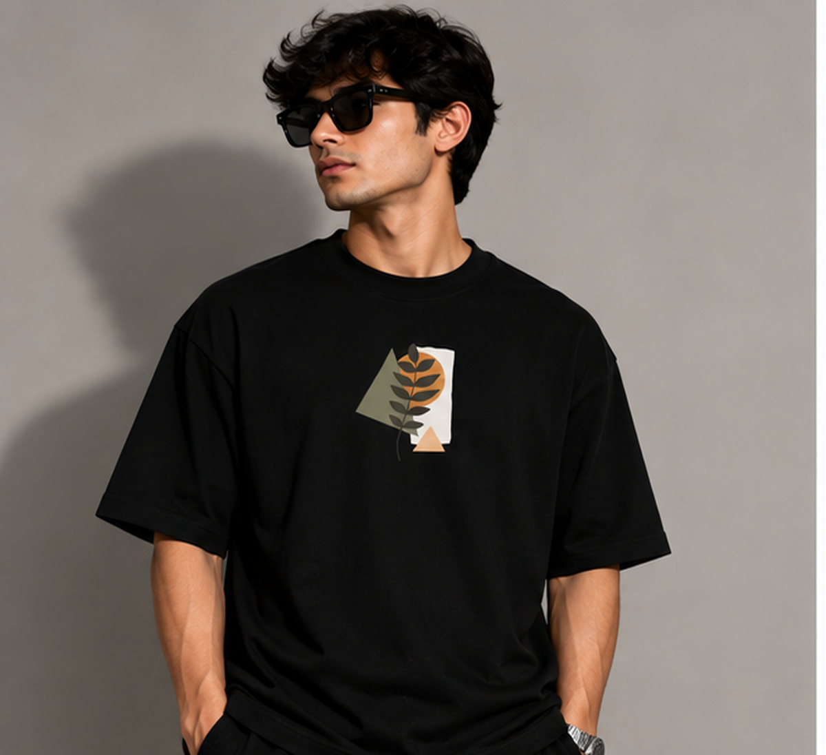 Model wearing the Selinx CLOTHE YOURSELF black oversized tee, front view with minimal leaf graphic