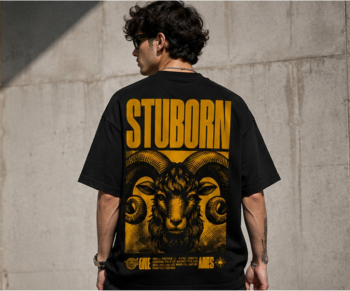 Back of the Selinx STUBORN black oversized tee showing the golden ram graphic