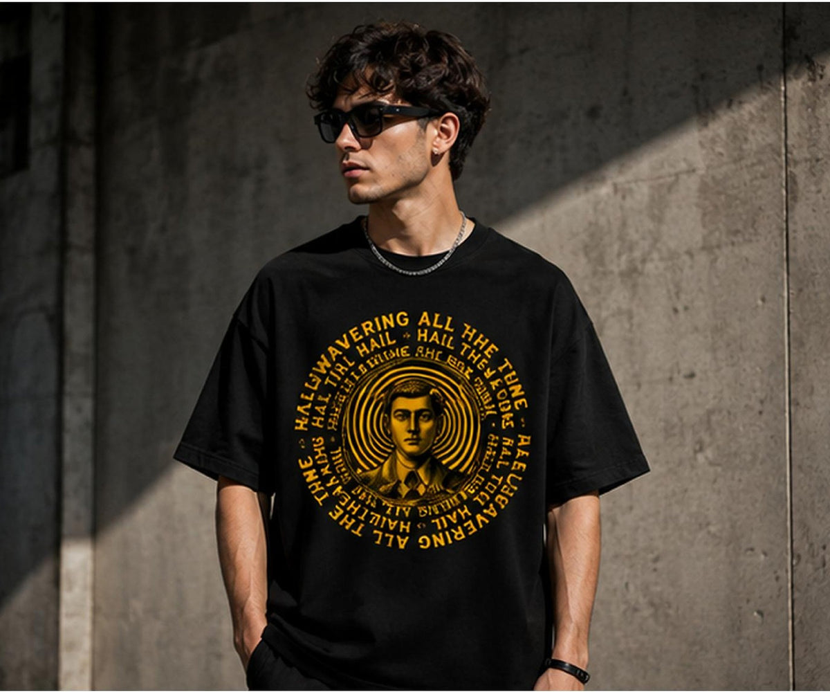 Model wearing the Selinx STUBORN black oversized tee against a concrete wall