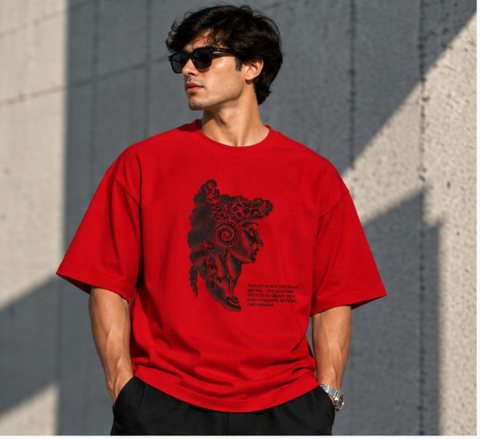 Model wearing the Selinx CREATE YOUR REALITY red oversized tee, front view with black portrait graphic